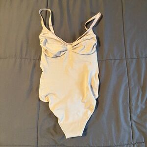 SKIMS Seamless Sculpt Thong Bodysuit in Shade “Clay”